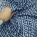 Атласная ткань из шелка  коричневый рисунок на голубом фоне.
